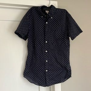 Navy blue short sleeve shirt with white polka dots